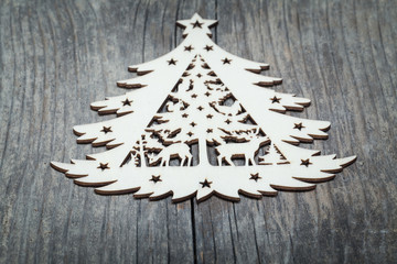 Wooden Christmas tree on wooden background