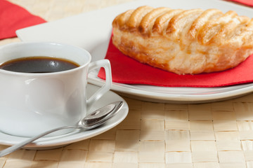 Breakfast including coffee, bread, honey.