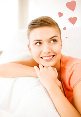 Obraz premium happy woman in love dreaming at home