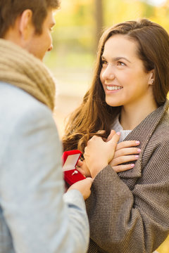 Man Proposing To A Woman In The Autumn Park