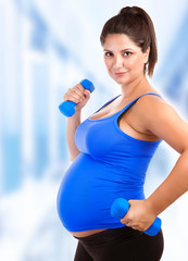 Pregnant woman do fitness