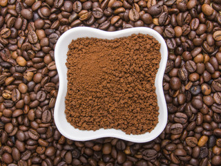 instant coffee on coffee beans background