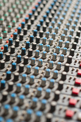 Fototapeta premium Detail of a music mixer in studio, closeup.