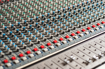 Audio mixing console, closeup shot.