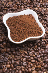 instant coffee on coffee beans background