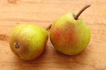 two pears fruits on wooden table background