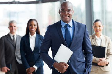 african businessman with group of businesspeople - 57355152