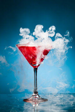 Red Cocktail With Ice Vapor