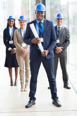 african american architect standing in front of colleagues