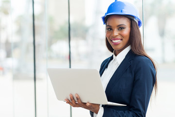 young african architect using laptop