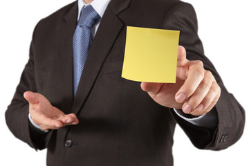 businessman hand show blank sticky note with white background as