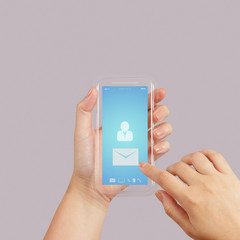 hand use Touch screen mobile phone with email icon as concept