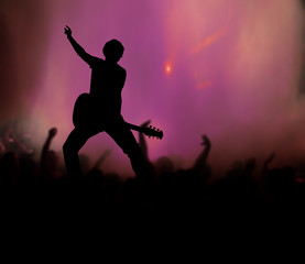 Obraz na płótnie Canvas guitarist at rock concert