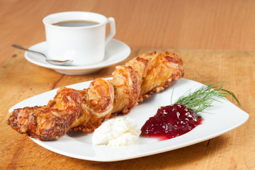 Light meal with coffee, bread and jam.