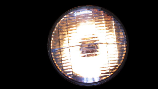 Real headlight turning on, flickering and turning off.