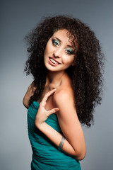 Naklejka premium Beautiful young woman with curly hair