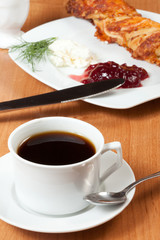 Light meal with coffee, bread and jam.