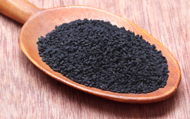 Nigella or Black cumin on a wooden spoon