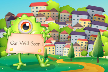 A monster holding a card at the hilltop across the village