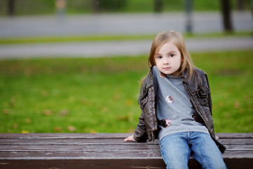 Adorable girl portrait outdoors at autumn