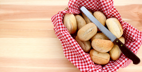 Basket of petit pain and a bread knife