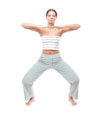 Obraz premium Pretty young woman doing exercise, full length