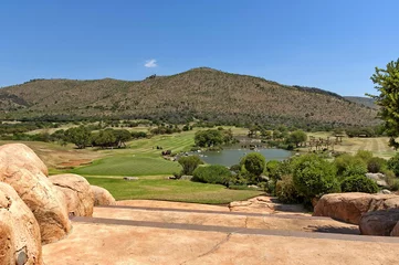 Gordijnen Golf playground and lake in Sun City, South Africa © intsys