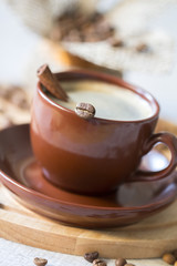 Cup of coffee with cinnamon close-up