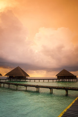 Over water bungalows with steps into amazing green lagoon