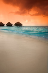 Over water bungalows with steps into amazing green lagoon