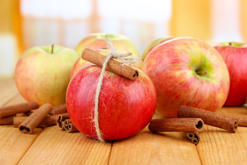 Ripe apples with with cinnamon sticks