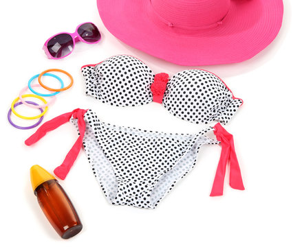 Swimsuit and beach items isolated on white