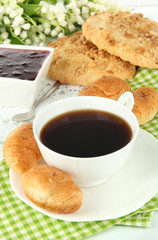 Tasty croissants and cup of coffee close-up