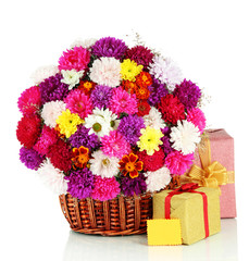 Fototapeta na wymiar Beautiful bouquet of chrysanthemums in wicker basket isolated