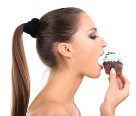 Portrait of beautiful young girl with chocolate cupcake