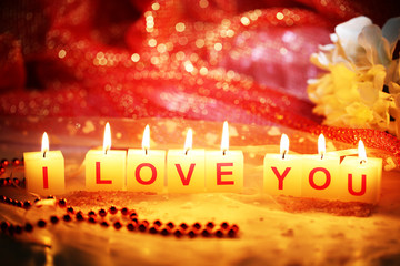Candles with printed sign I LOVE YOU,on  bright background