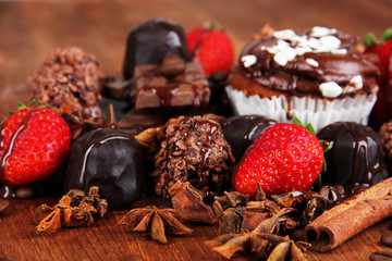 Tasty cupcake with different sweets close up