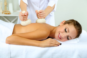 Obraz na płótnie Canvas Beautiful young woman having back massage close up