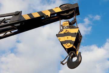 crane hook on a blue sky © chamillew
