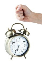 Alarm clock and hand isolated on white