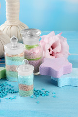 Fototapeta na wymiar Aromatic salts in glass bottles and herbal compress balls for