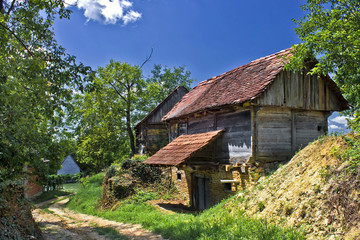 Fototapeta na wymiar Rural village with wooden cottages
