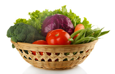 Different vegetables in basket isolated on white