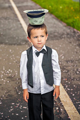 Funny boy wearing hat upside-down