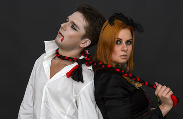 witch and a vampire on a dark background