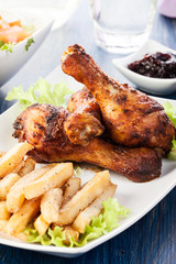 Chicken drumsticks with fries