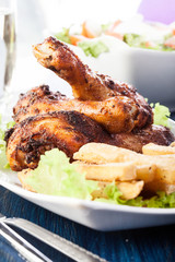 Chicken drumsticks with fries