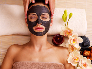 Cosmetologist doing massage on the woman's face  in sap salon