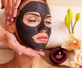 Cosmetologist doing massage on the woman's face  in sap salon