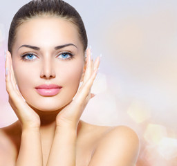 Beauty Portrait. Beautiful Spa Woman Touching her Face